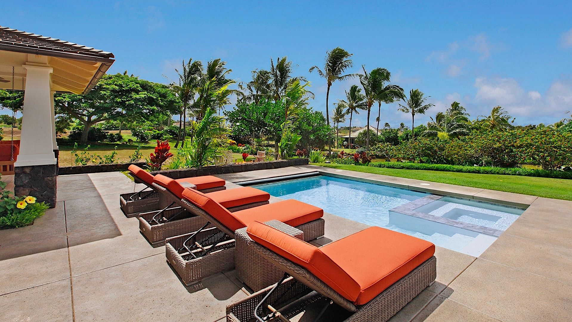 Lounge Chairs on the side of A Private Pool at A Luxury Kauai Vacation Rental