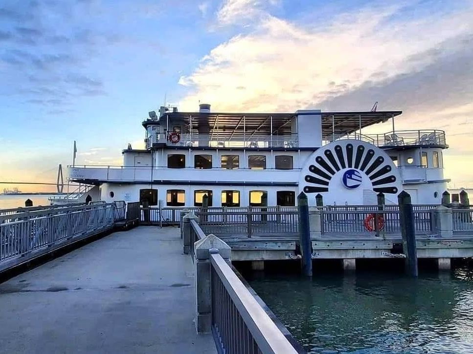 A large tour boat docks at Fort Sumter, where history buffs explore one of Charleston’s most famous landmarks. The fort stands proudly against the harbor backdrop, known for its role in the Civil War.