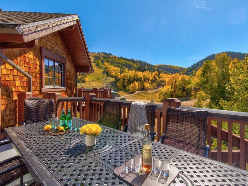 Exterior patio of Park City vacation rental that overlooks stunning fall foliage colors