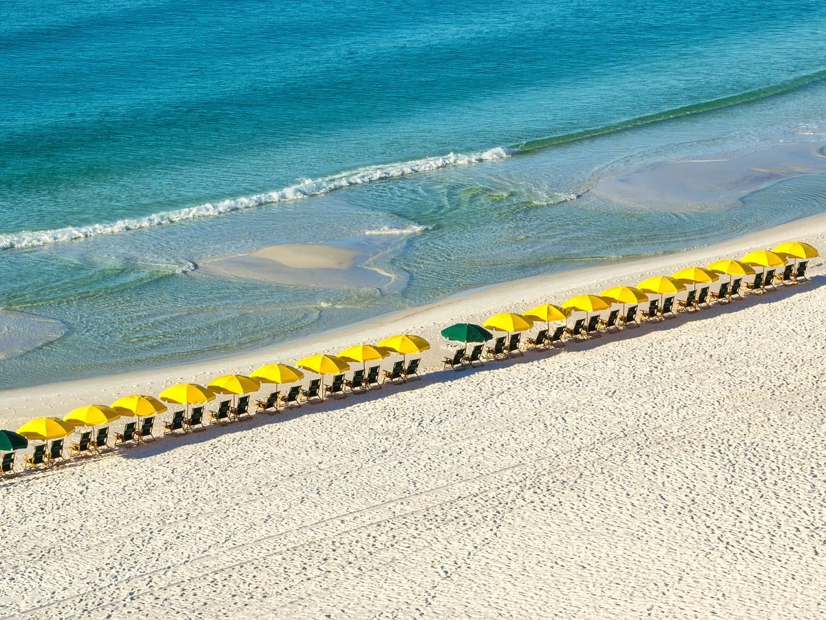 View of the Gulf and Chairs with Umbrellas on Beach in Destin Florida