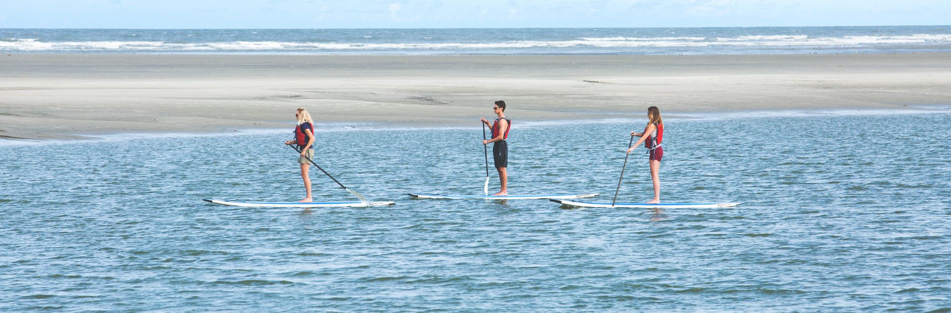 A wide view of Kiawah Island Golf Resort showcasing lush fairways and coastal surroundings. The resort is known for world-class golf, nature views, and luxury amenities.