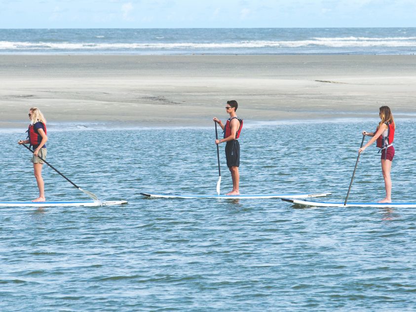 A wide view of Kiawah Island Golf Resort showcasing lush fairways and coastal surroundings. The resort is known for world-class golf, nature views, and luxury amenities.