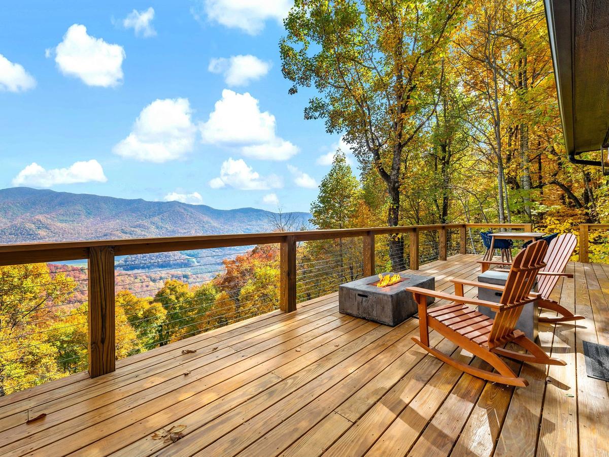 Chairs and Fire Pit on Luxury Asheville Vacation Rental Deck Overlooking Mountains
