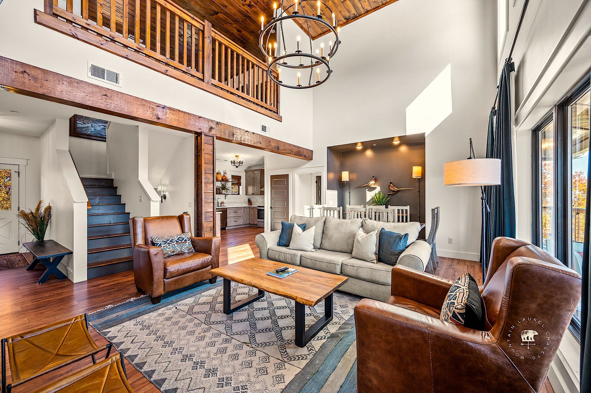 Beautiful Living Room, Dining Room, and Kitchen in Luxury Gatlinburg Vacation Rental 