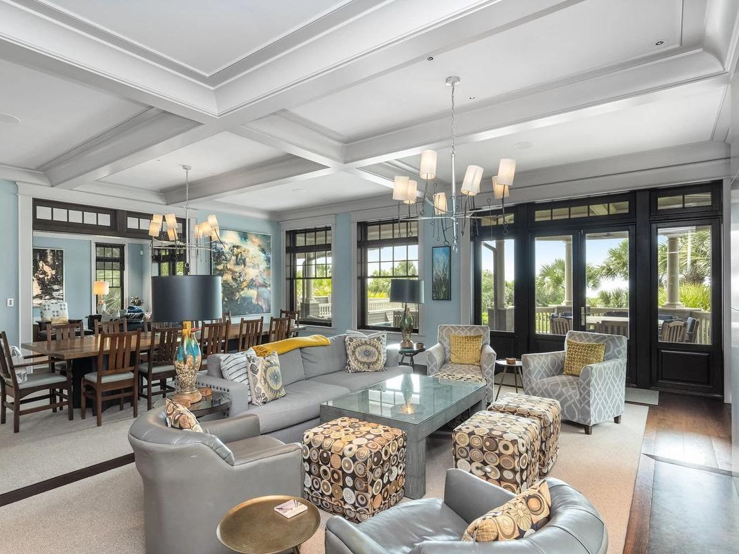 This stunning multi-level home blends classic Lowcountry design with luxury touches like a pool, hot tub, and wraparound porches made for relaxing under the sun.
