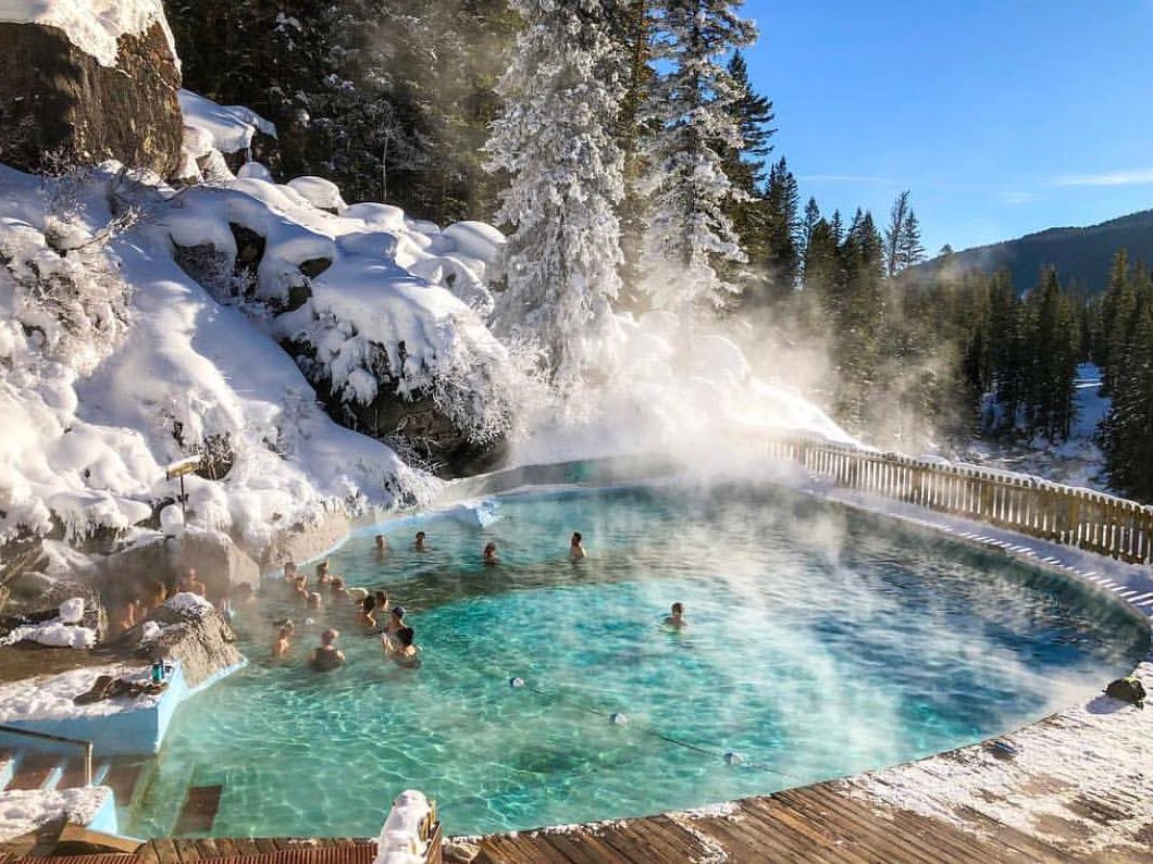 Surrounded by snowy pine trees, Granite Hot Springs Pool steams in the cold winter air as visitors soak in its warm waters. This mountain hot spring is a true Wyoming hidden gem.