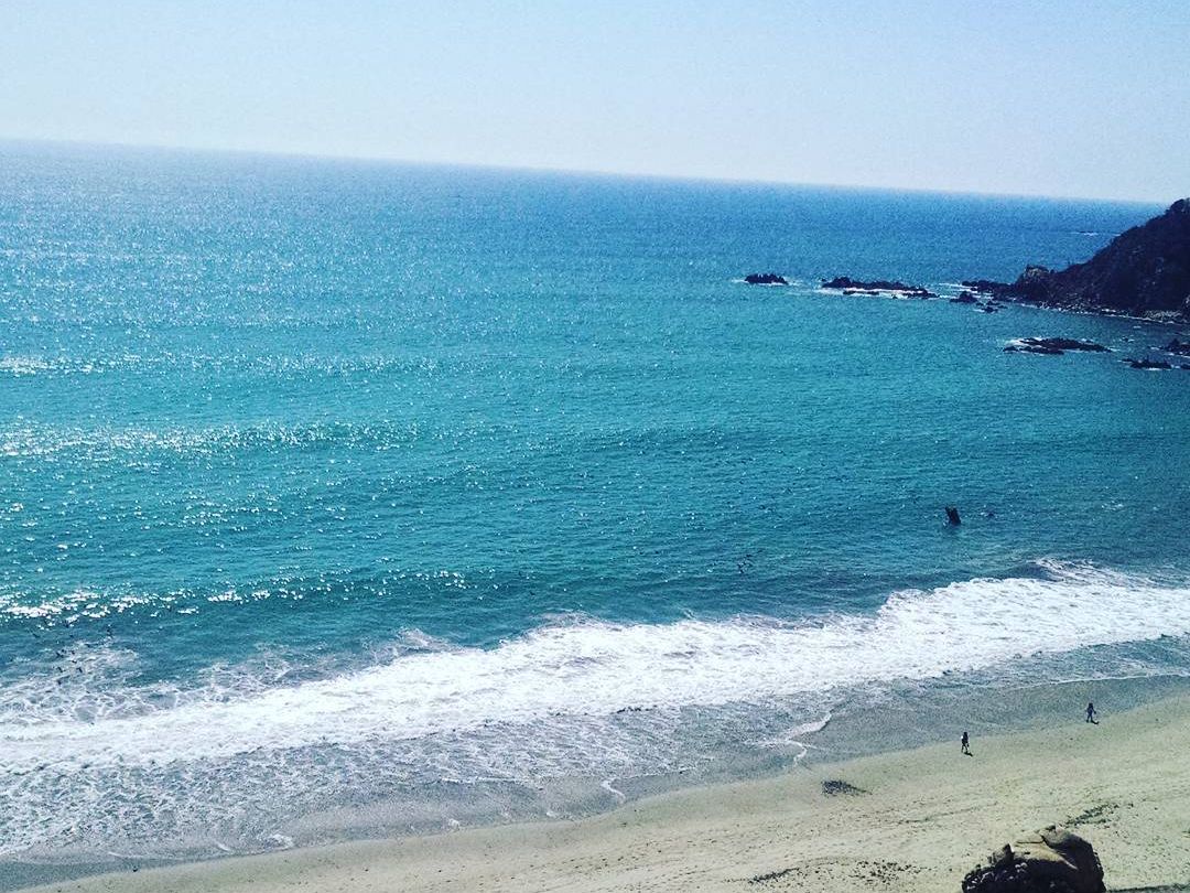 Playa La Bocana is known for its powerful waves and natural beauty, making it popular for surfing and long beach walks. Its wide shoreline is perfect for watching sunsets in Huatulco.