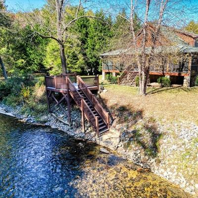 Exterior view of a riverfront cabin rental in Suches, GA.