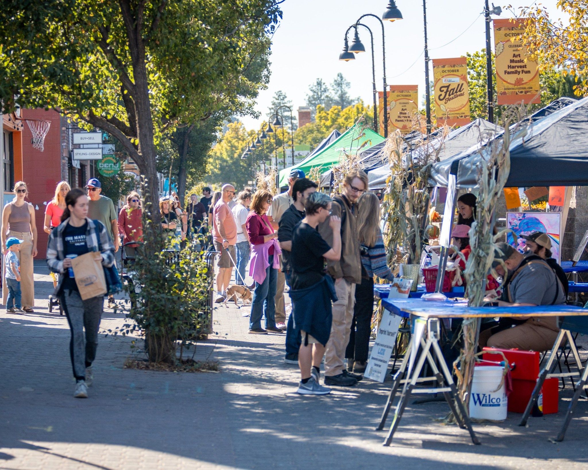 owntown Bend comes alive with colorful vendor tents, fall decorations, and crowds strolling under sunny skies. Locals and visitors browse handmade crafts, enjoy seasonal treats, and soak in the festive harvest atmosphere of the Bend Fall Festival.