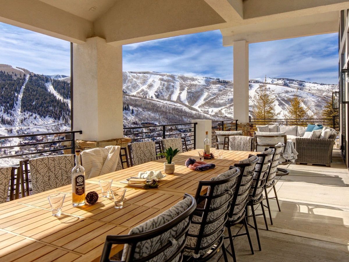 Outdoor patio of vacation rental in Park City with stunning snowy mountain views