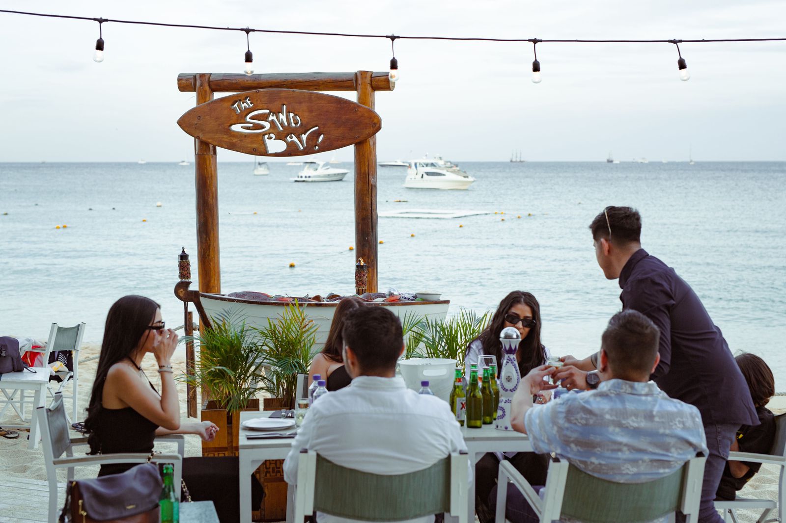 Right on the beach, The Sand Bar offers a relaxed dining experience with ocean views and a cool sea breeze. Guests enjoy fresh seafood, cocktails, and lively conversation just steps from the water.