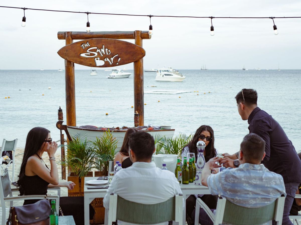 Right on the beach, The Sand Bar offers a relaxed dining experience with ocean views and a cool sea breeze. Guests enjoy fresh seafood, cocktails, and lively conversation just steps from the water.
