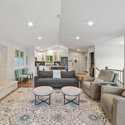 Open floor plan with fireplace in Peaceful Lakefront Cottage.