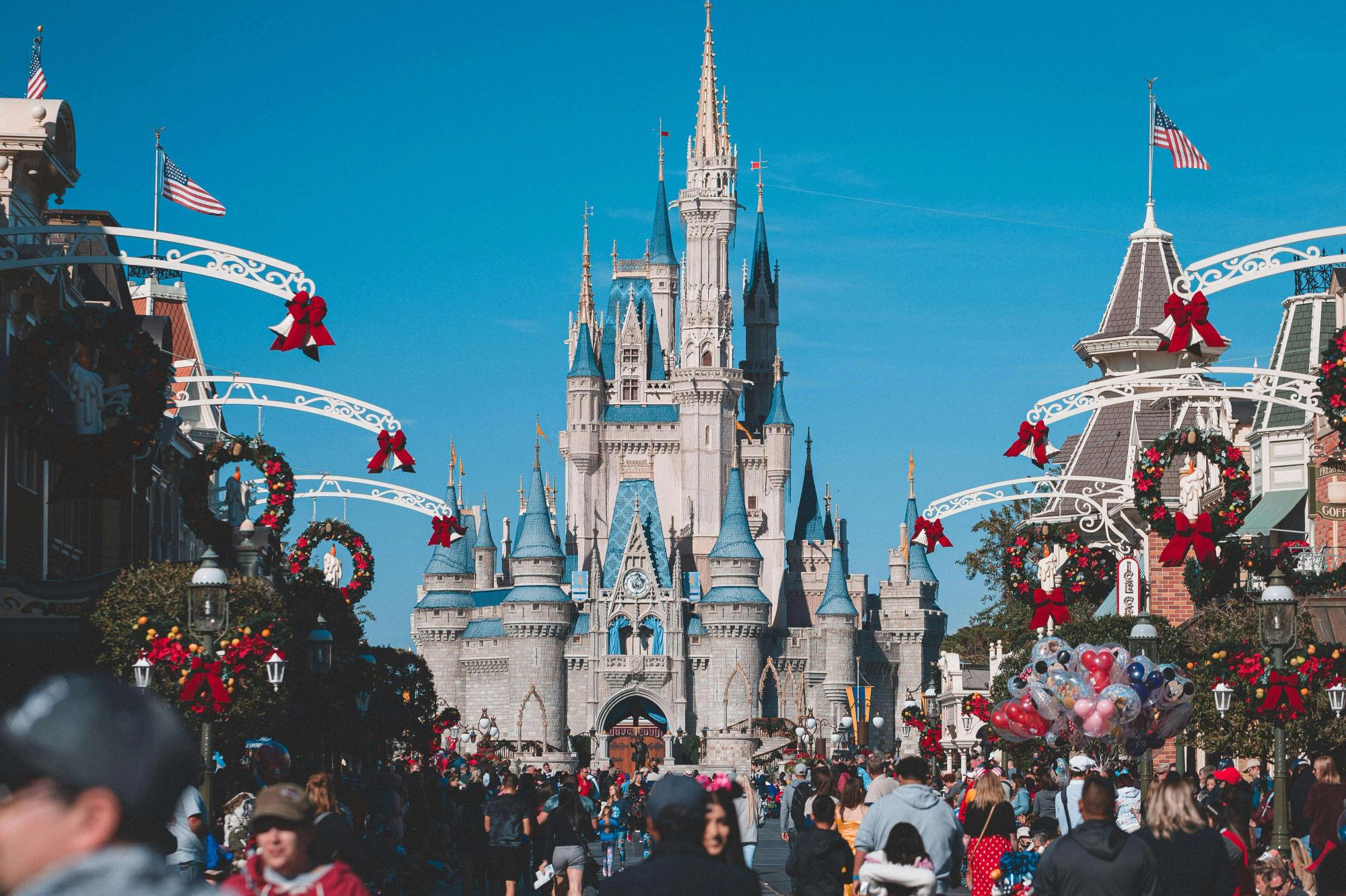 Families and kids smile wide as they explore the magic of Disneyland Orlando, surrounded by bright colors, fun rides, and famous characters. With laughter in the air and excitement everywhere, it’s a dream day come to life.