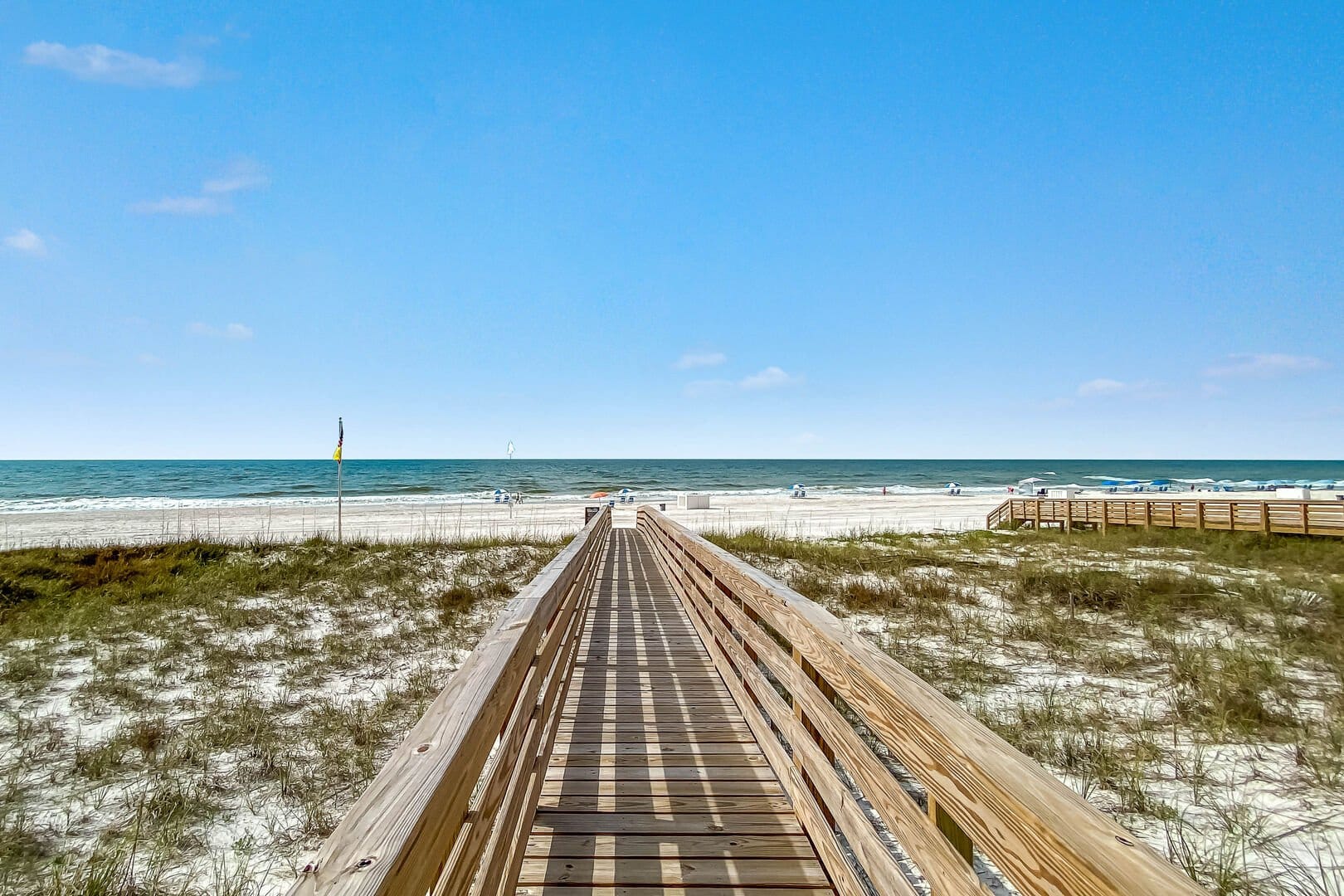 Wooden beach boardwalk leading to gulf shores beach