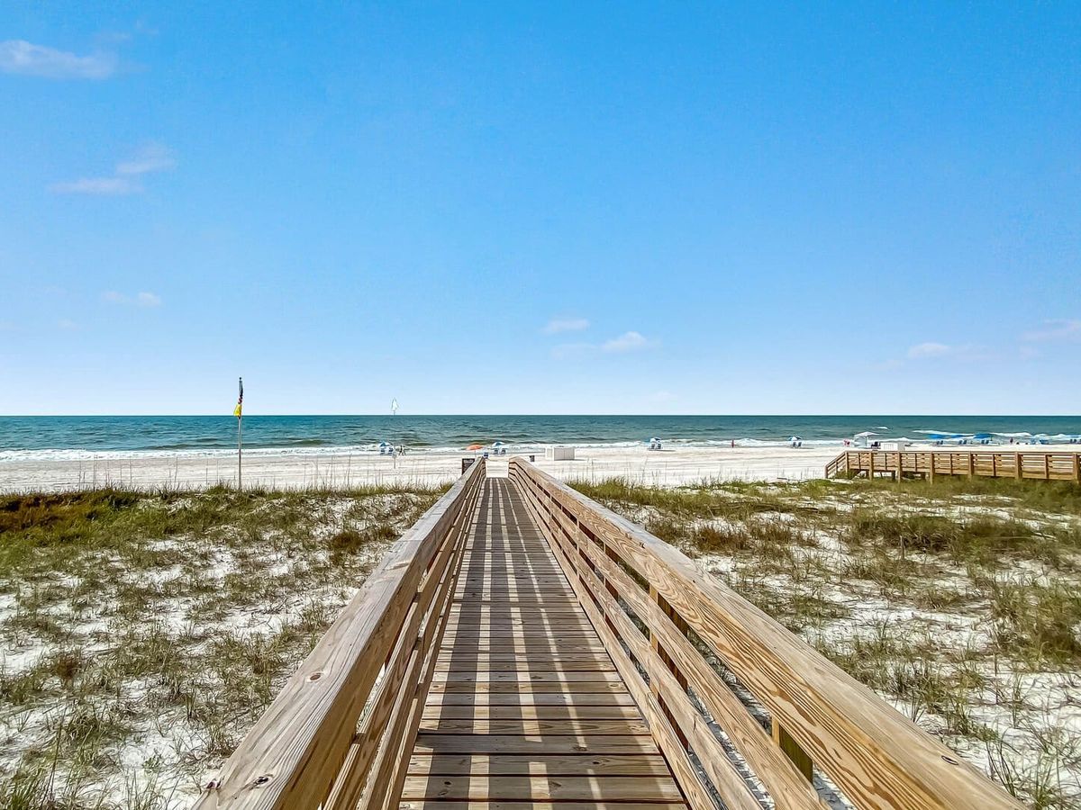 Wooden beach boardwalk leading to gulf shores beach