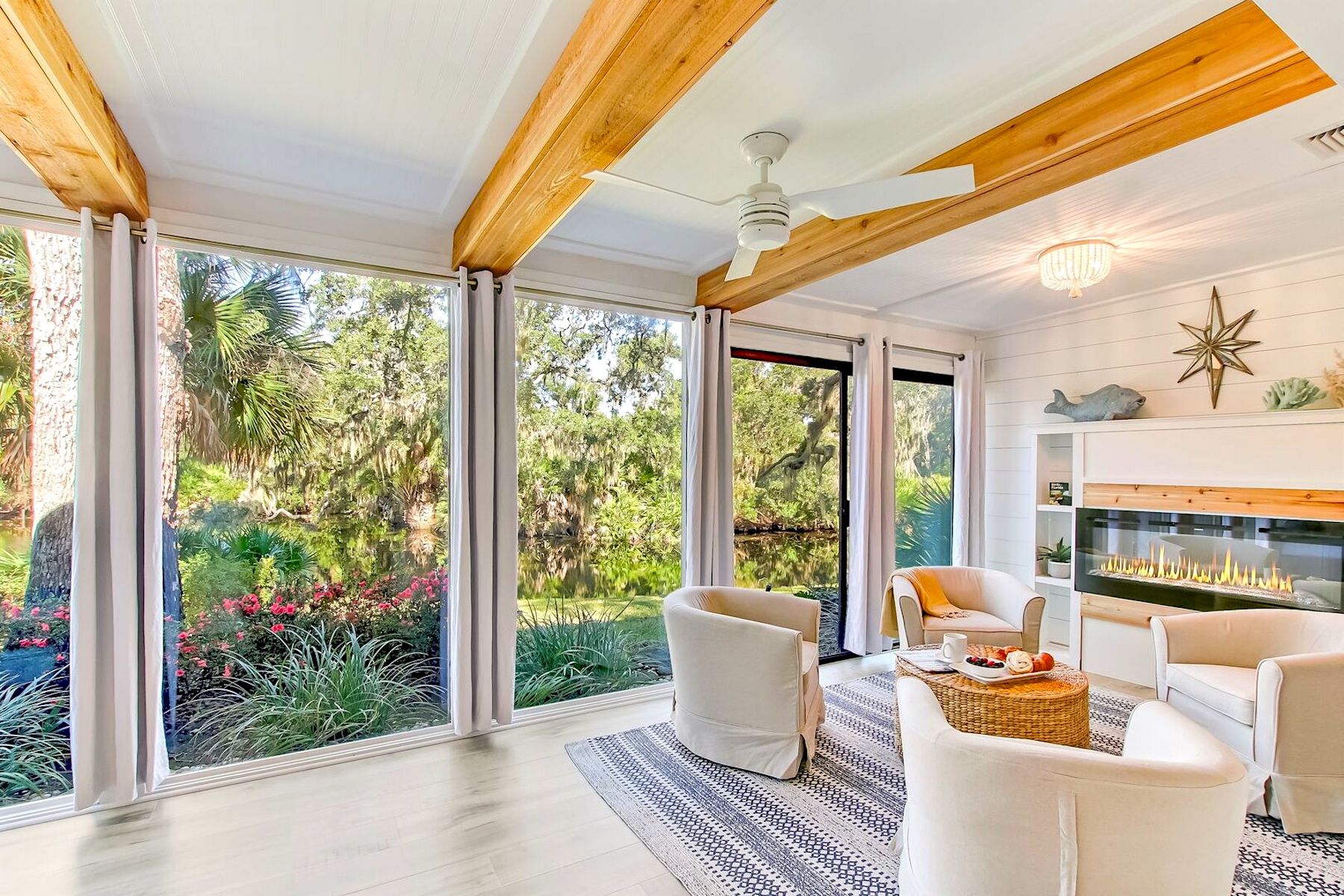 Living Room With Fireplace and Lagoon Views in Luxury Amelia Island Villa Rental