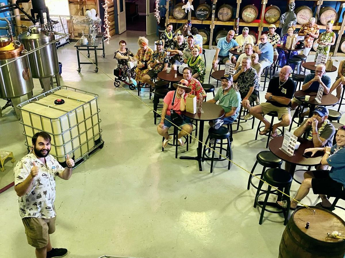 Guests enjoy a lively rum tasting experience at a Siesta Key distillery, surrounded by barrels and tropical décor. This indoor tour gives you a behind-the-scenes look at how local rum is made while you sip and relax with friends.