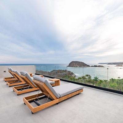 Outdoor living space with sea views at La Montosa.