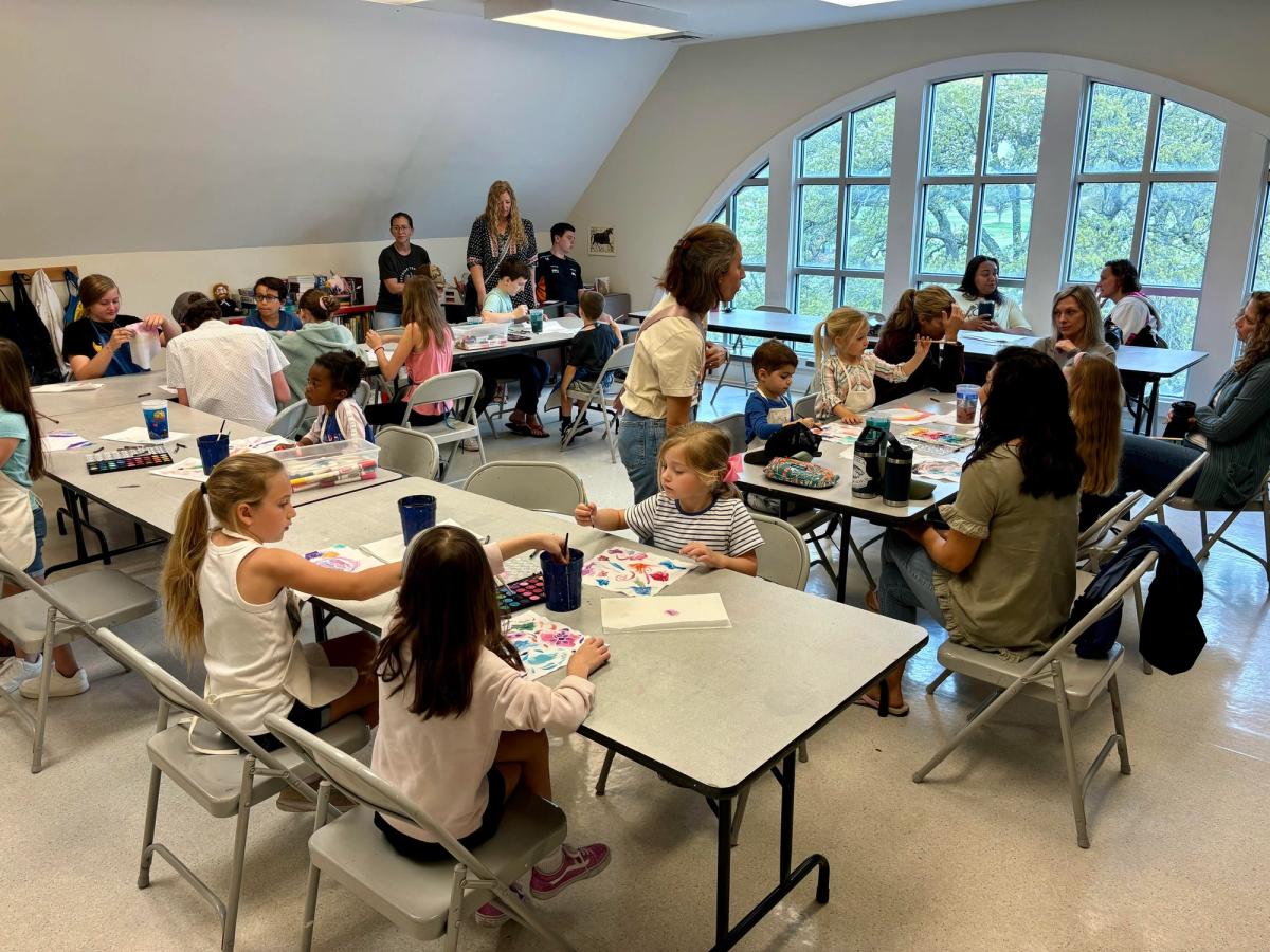 Families and children enjoy a hands-on art class inside the Franklin G. Burroughs-Simeon B. Chapin Art Museum in Myrtle Beach. The bright classroom and creative activity show why this local art museum is a fun indoor stop for kids and parents.