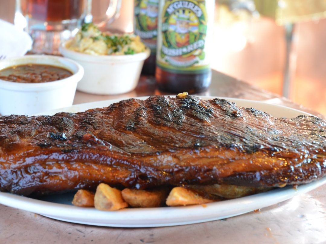 Tender, glazed baby back ribs served with steak fries, beans, and mashed potatoes. A hearty plate from McGuire’s Irish Pub in Destin.