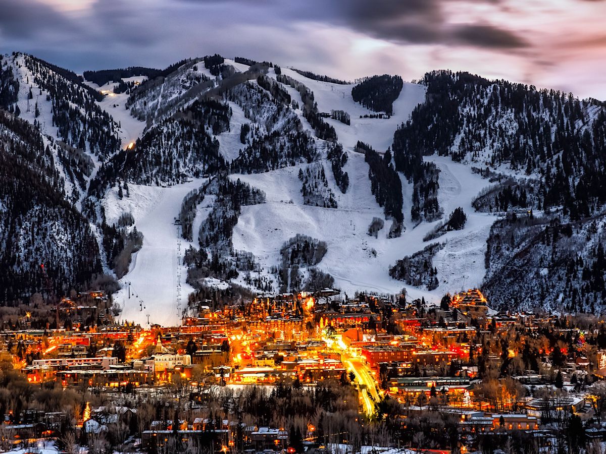 Aerial View of The Town of Aspen At Night With Aspen Mountain in the Background
