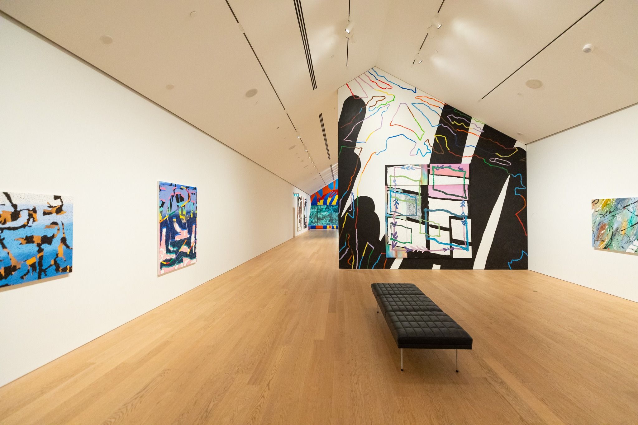 Inside the Audain Art Museum in Whistler, colorful modern art fills the bright gallery space. Clean white walls and wood floors create a calm setting to explore Canadian and Indigenous artwork. It’s a must-visit cultural stop in Whistler Village.