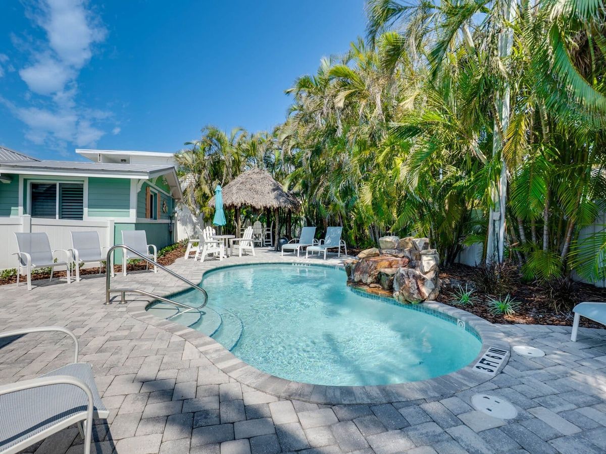This private pool at Sunset Azul is surrounded by palm trees, lounge chairs, and tropical landscaping. It’s the perfect place to cool off after a beach day or enjoy a quiet afternoon in the sun.