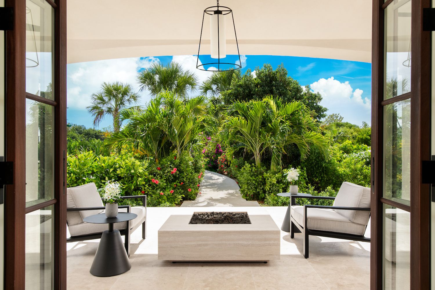 Outdoor Seating Area Surrounded by Trees at Turks and Caicos Luxury Rental