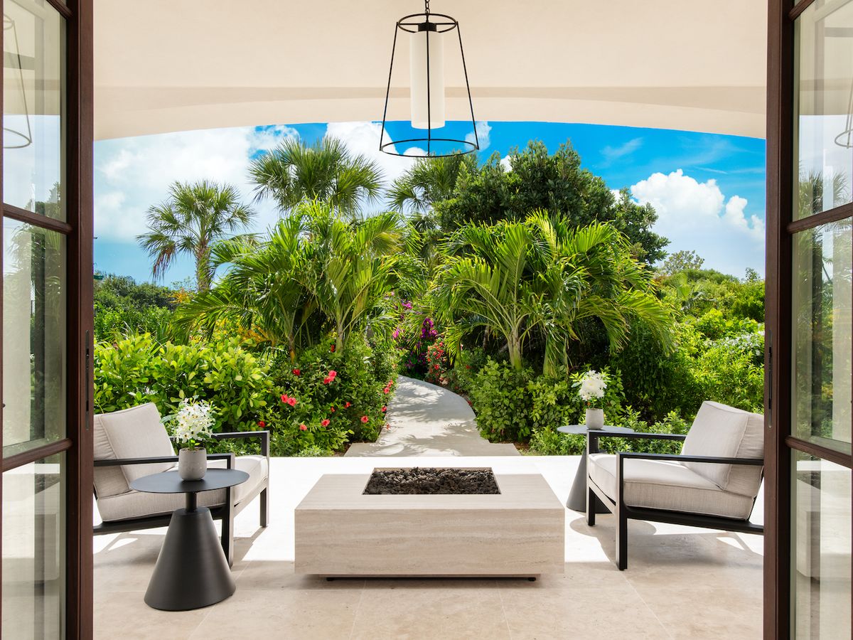 Outdoor Seating Area Surrounded by Trees at Turks and Caicos Luxury Rental