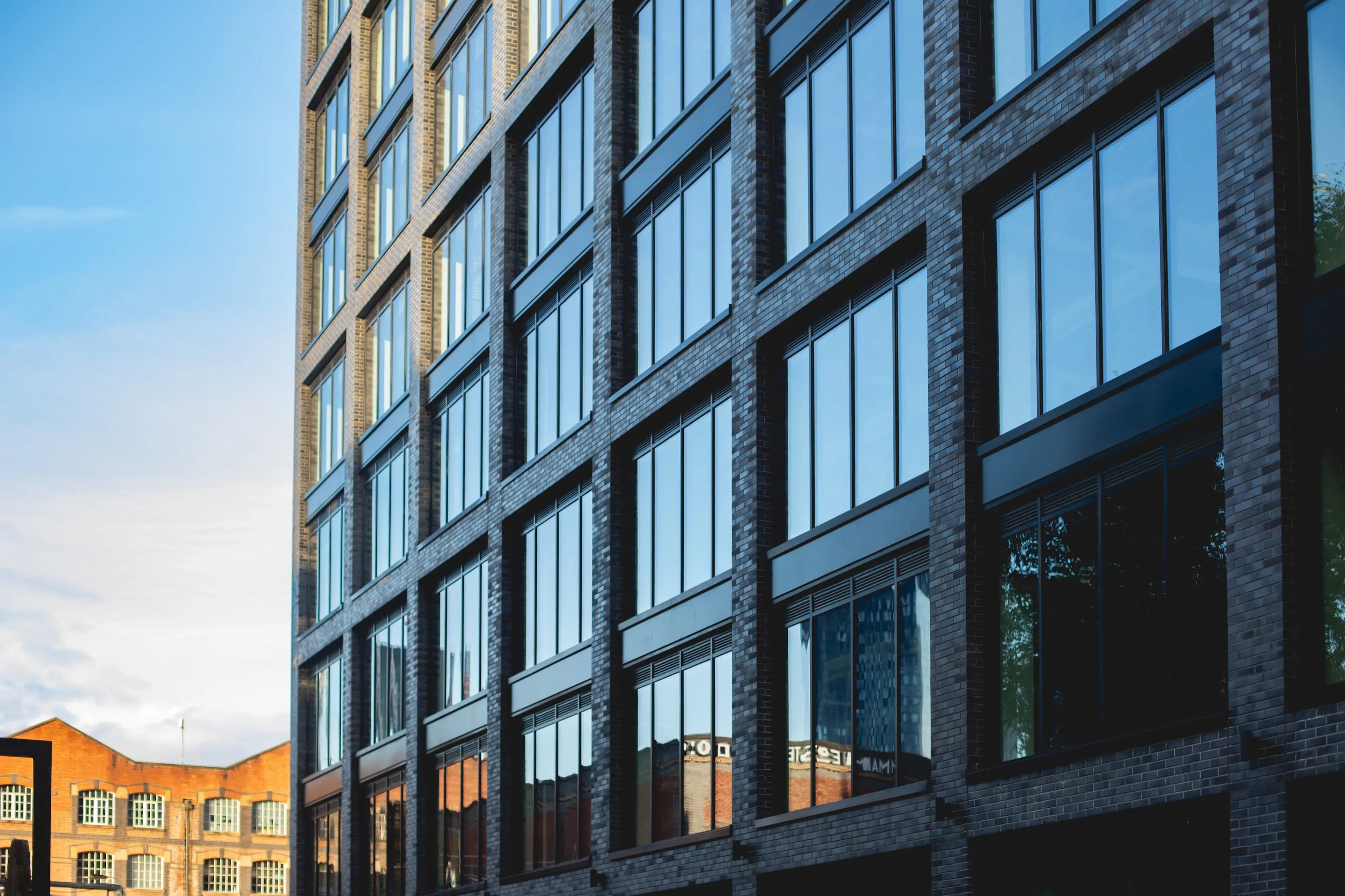 Modern brick office building with large windows