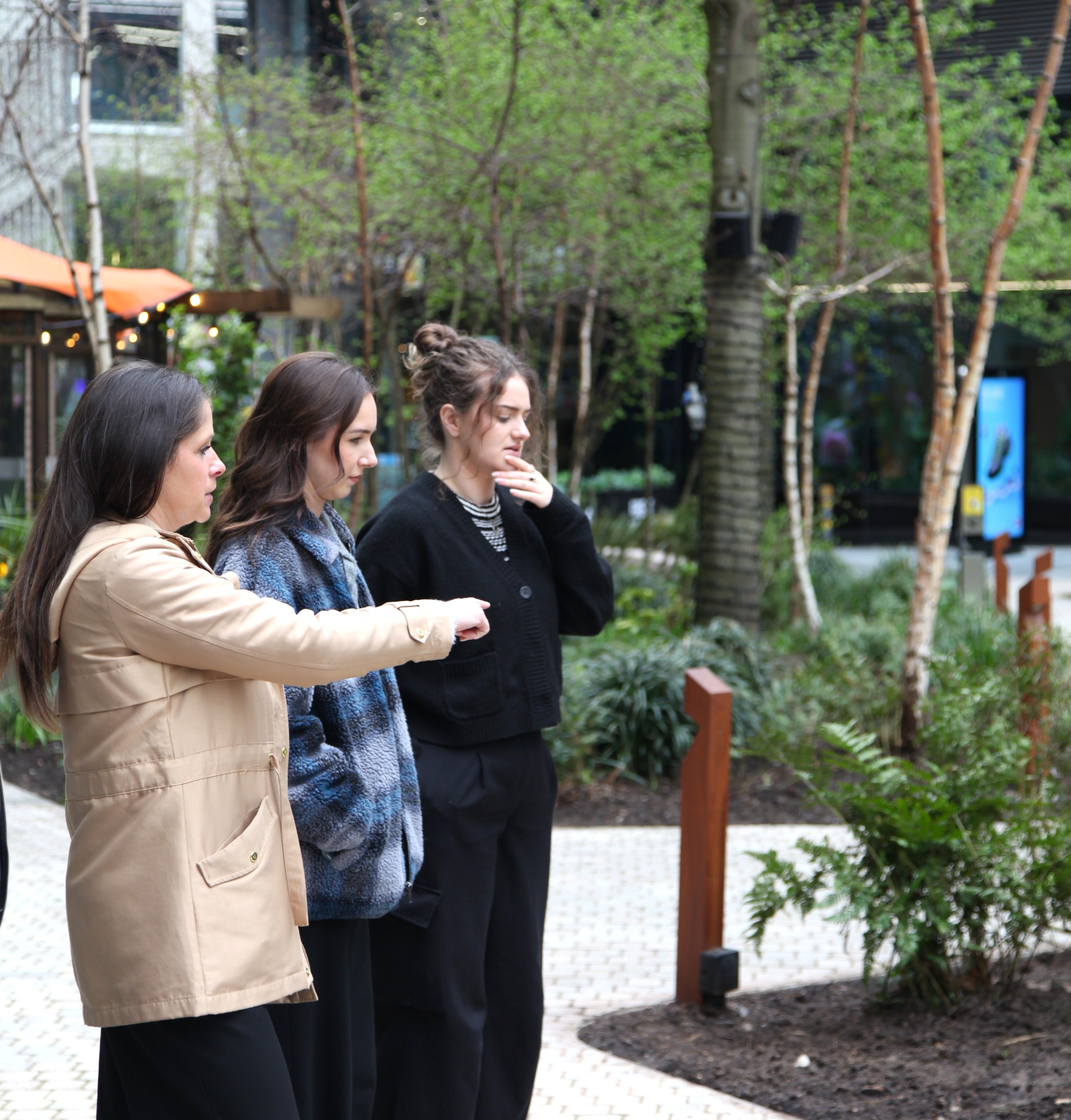 Gill, Emily and Caitlin inspecting Hardman Gardens in Spinningfields