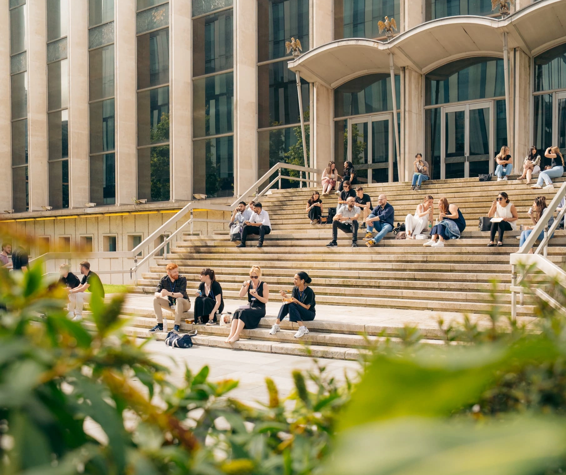 People sat on steps in Spinningfields