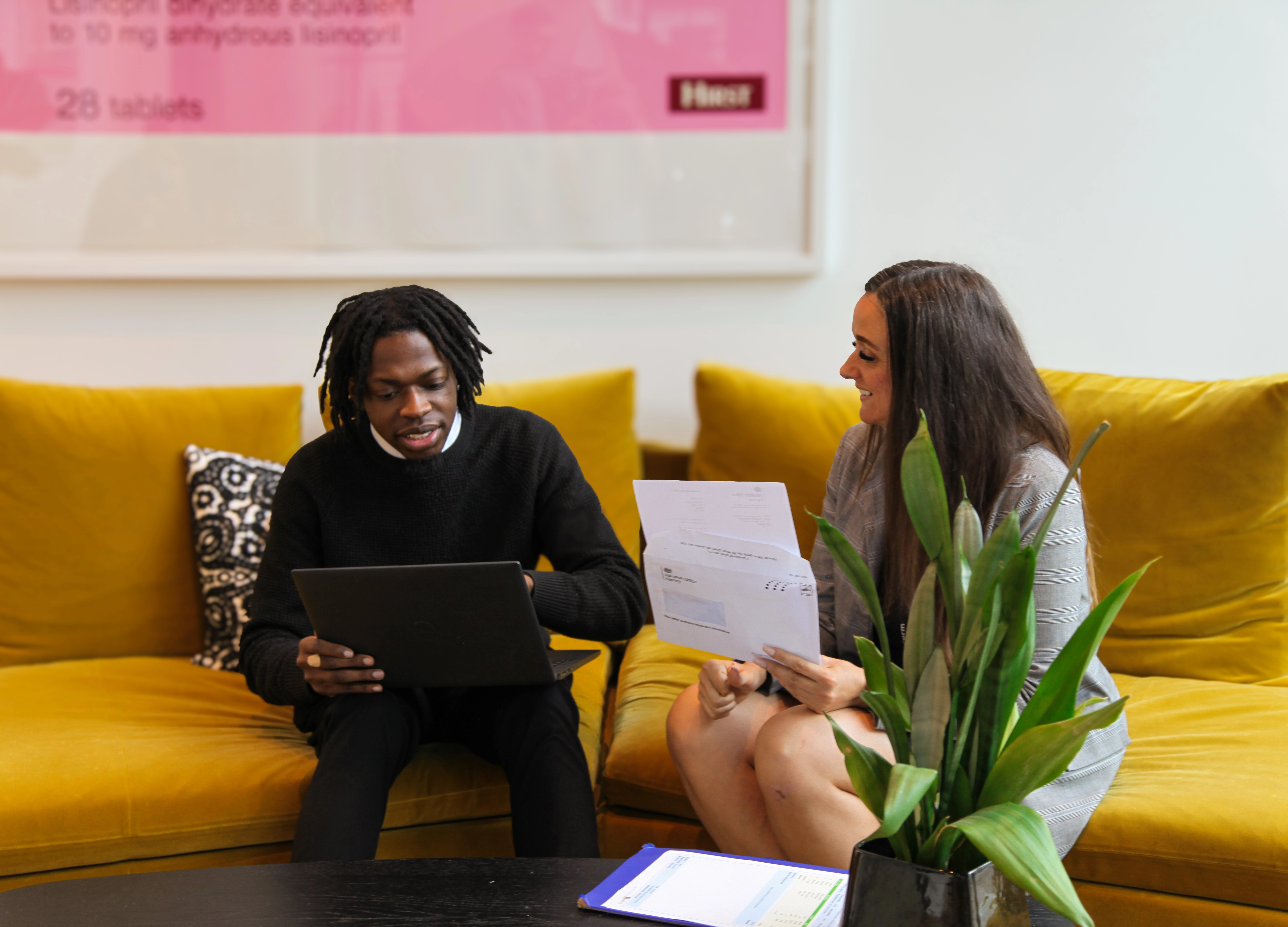 Andrea and Ademola in a meeting