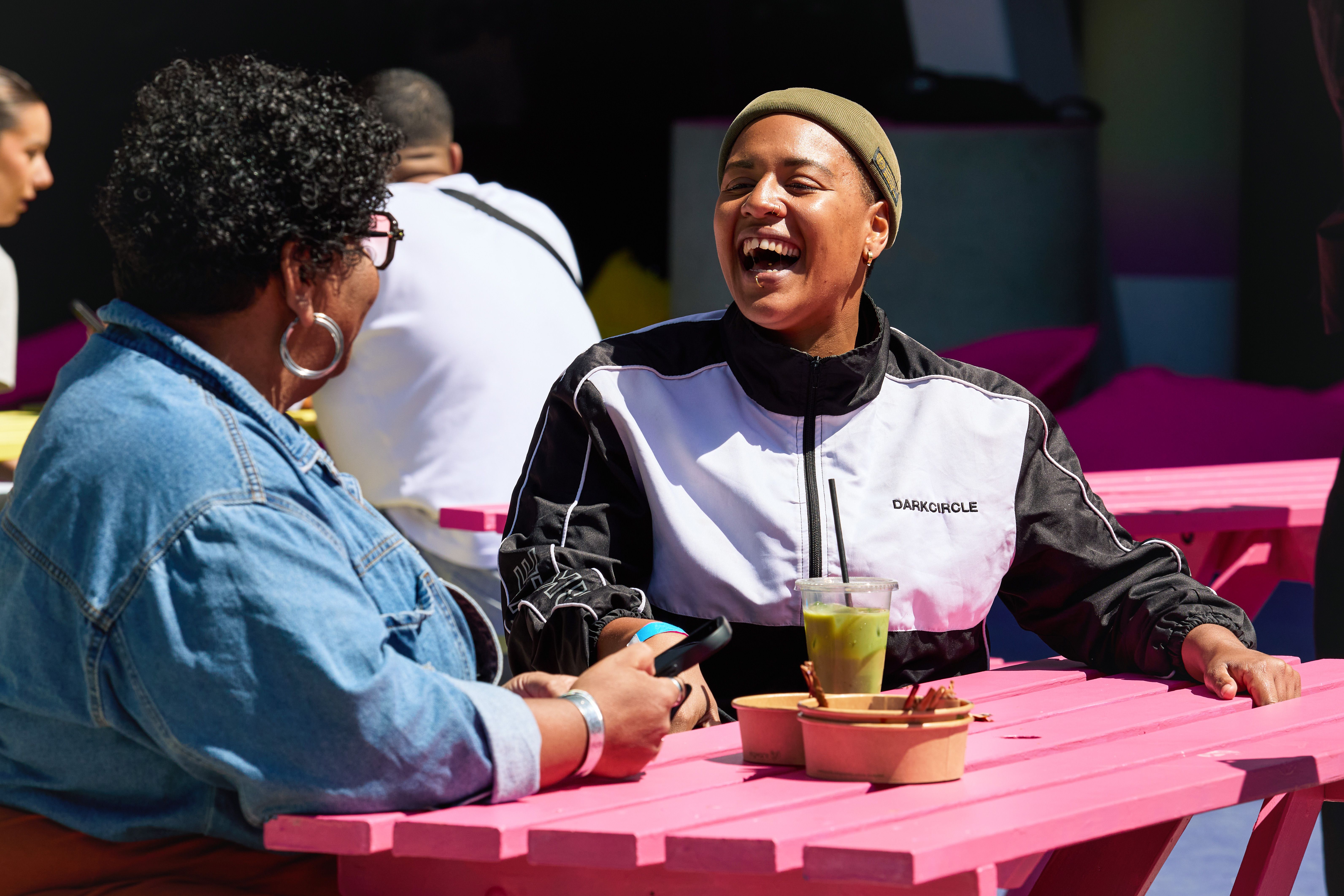 2 ladies laughing, enjoying a matcha in St. John's
