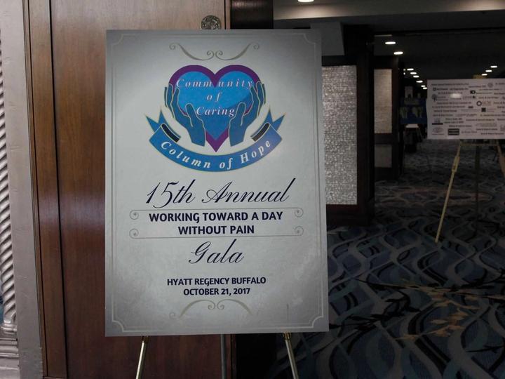 Community of Caring Gala poster, 2017, on its easel at the Hyatt Regency Buffalo