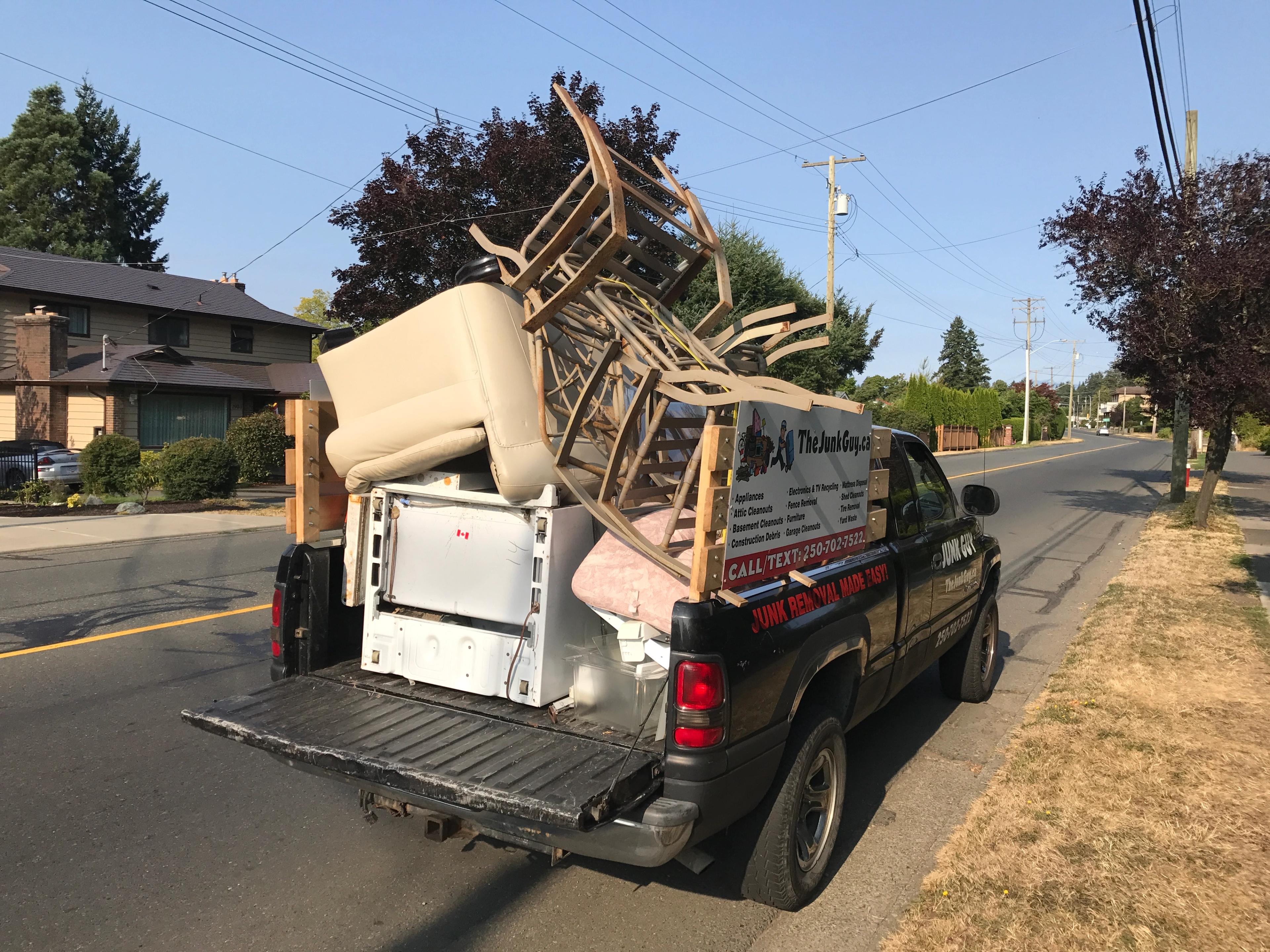 Fridge, couch and six kitchen chairs in one full load
