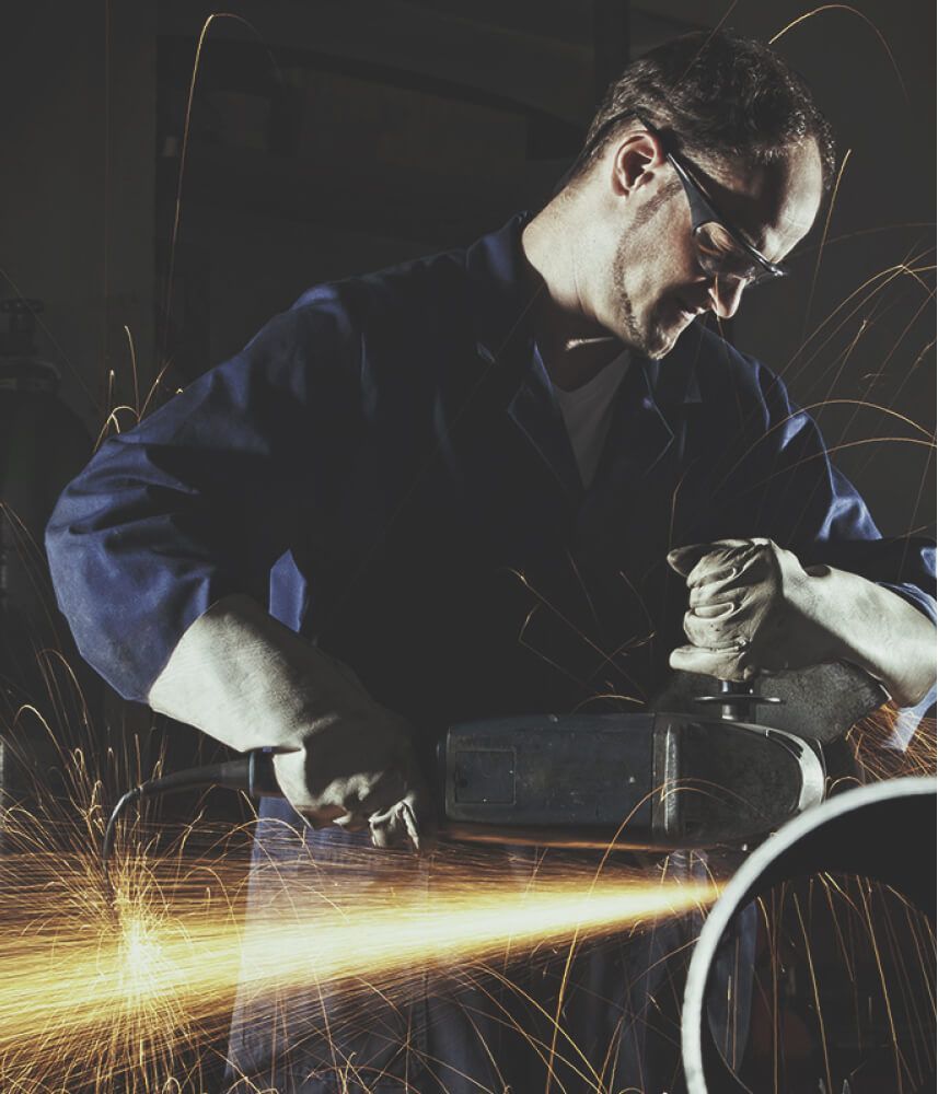 A man using a saw