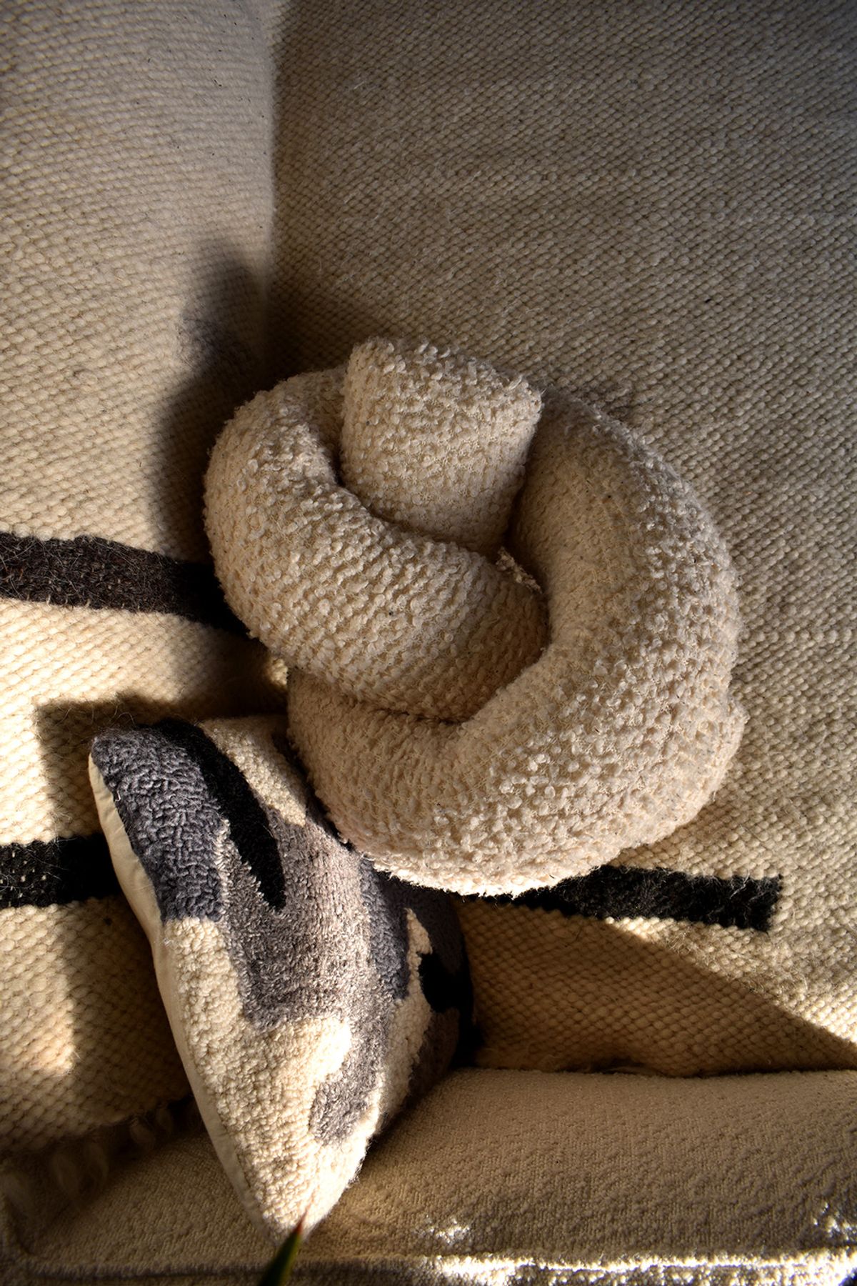 Pillows on boucle sofa