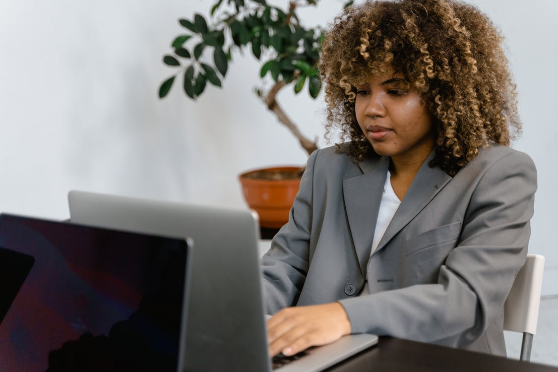 A woman using her laptop at work