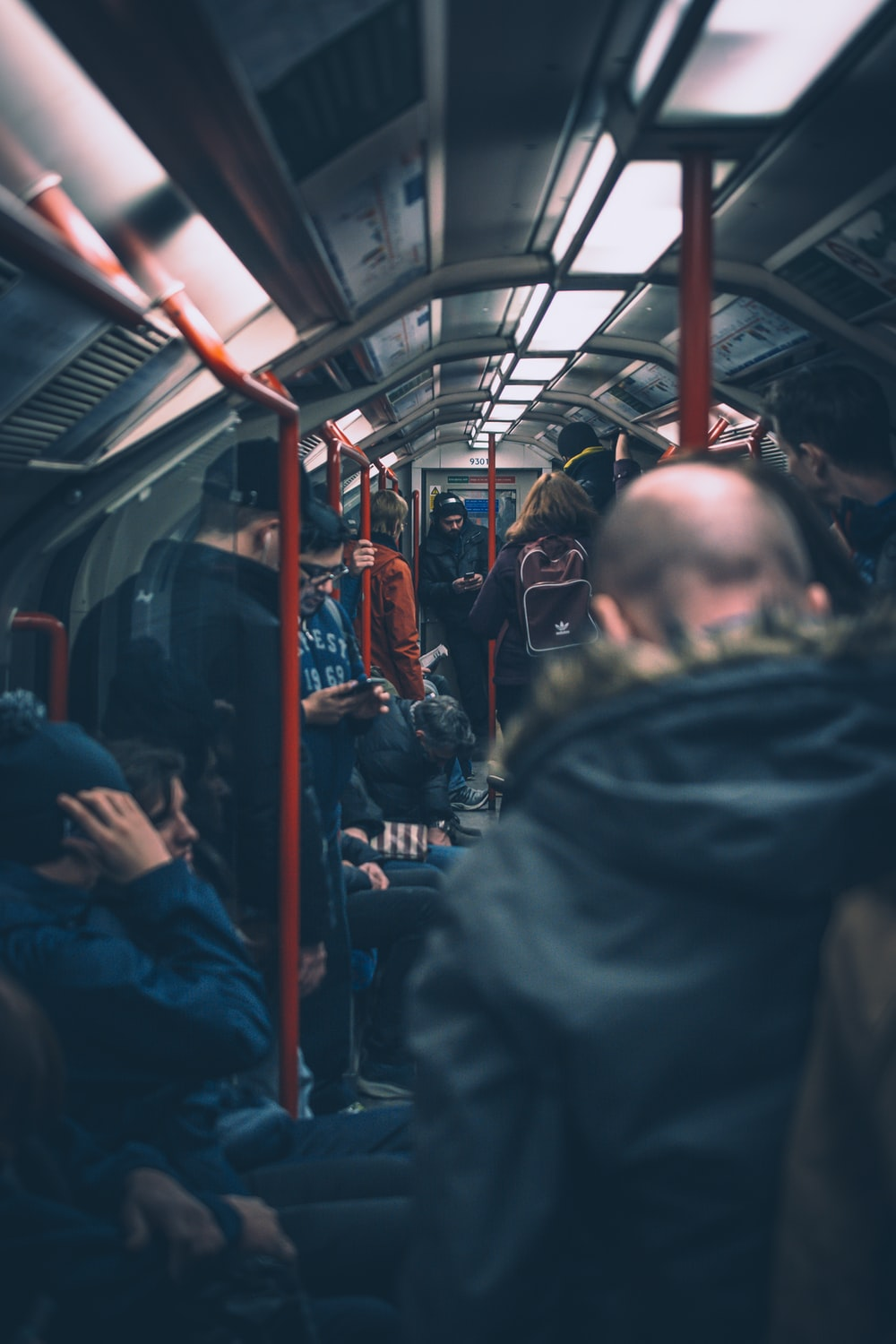 People using their phones on a train