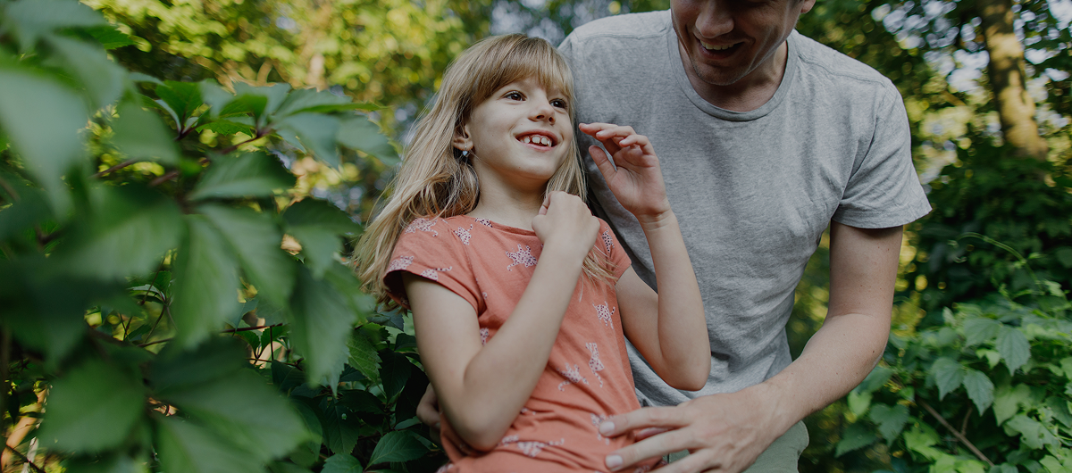 A child and her father in a field - A decorative image from Usal Project