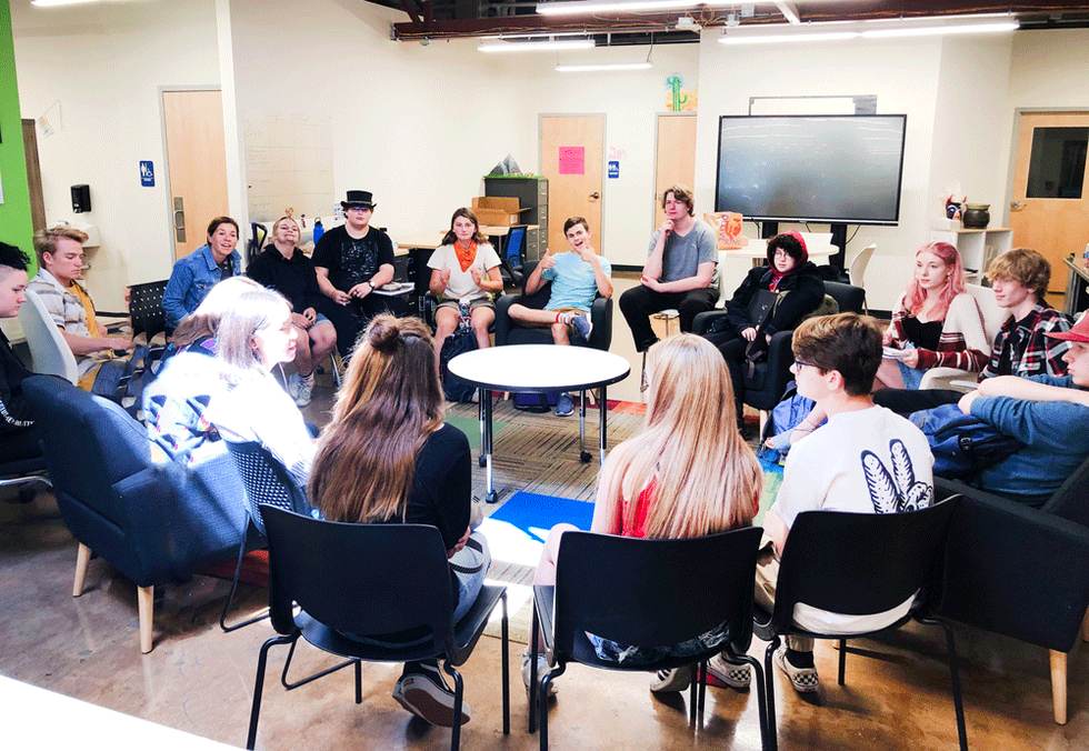 11th grade students discussing their independent Inquiries