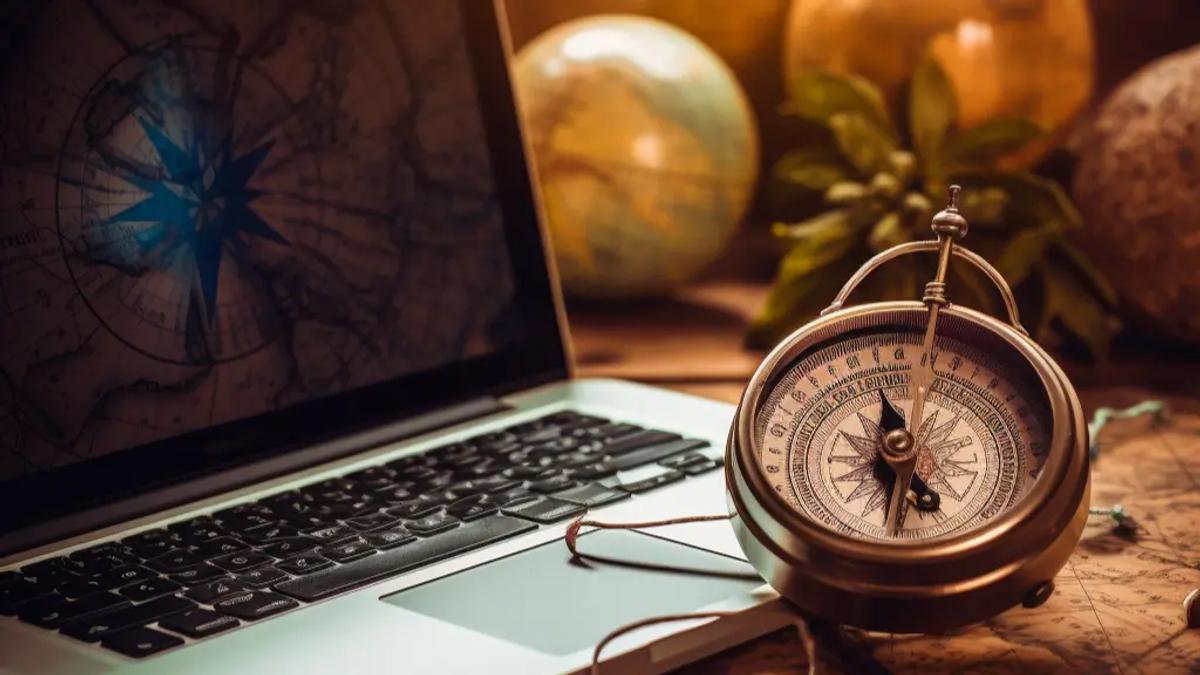 laptop with a compass on it.