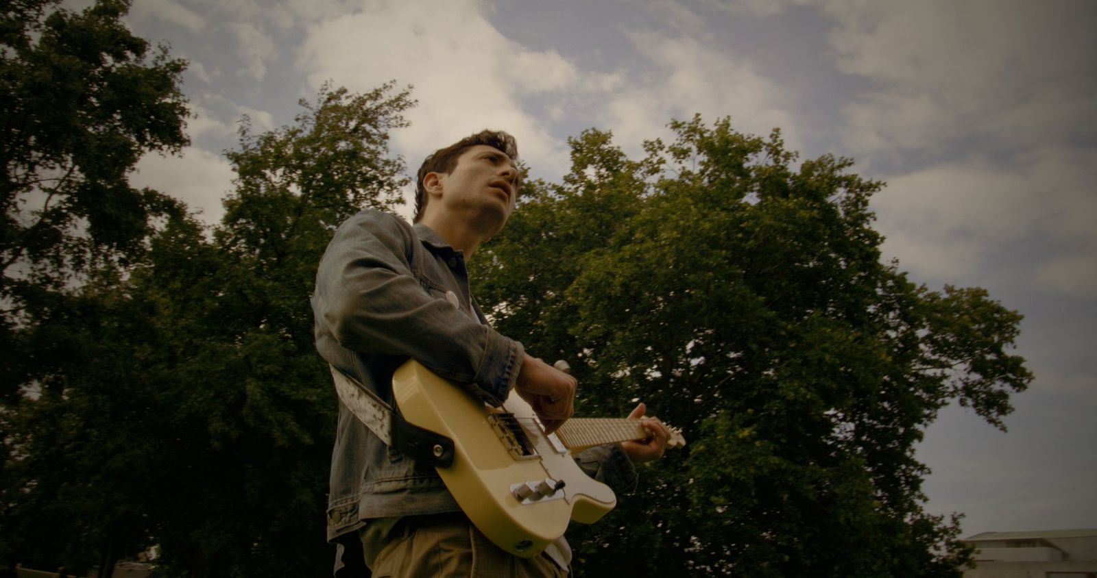Guitar-first, no audience but the trees.
