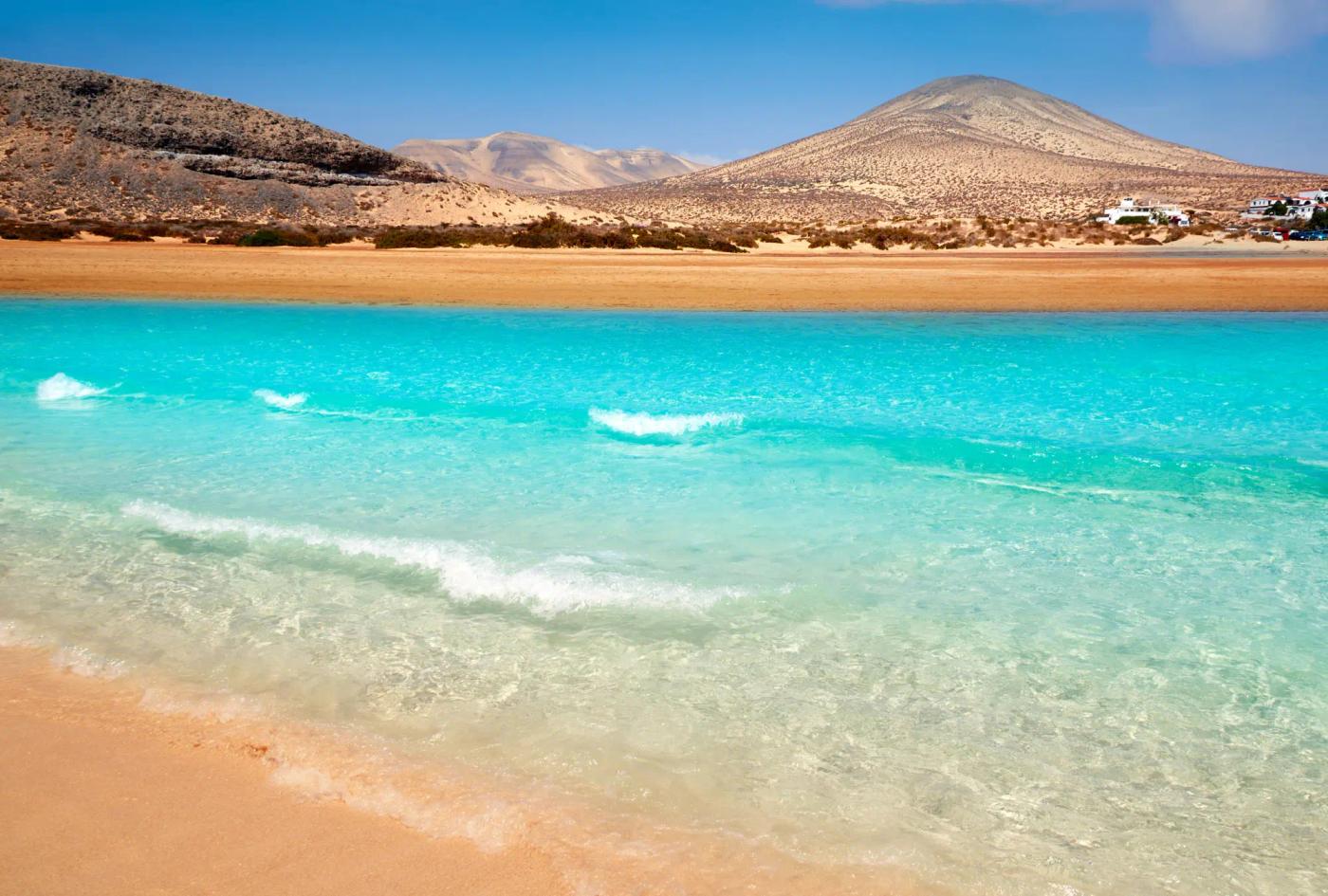 A beach in Jandia, Fuertaventura with mountains in the background