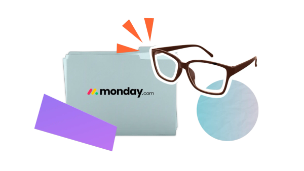 A pair of glasses beside a folder labelled with the monday.com logo