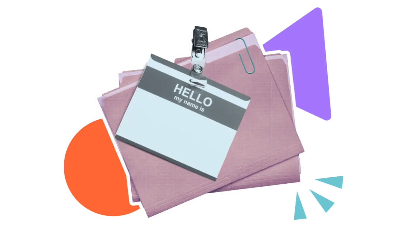 A stack of folders with an employee badge on top