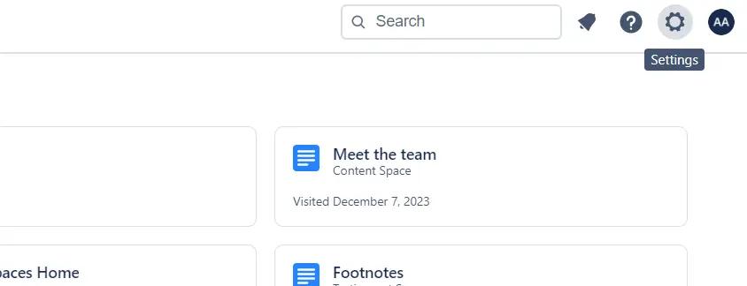 A user highlighting the Settings cog in the top-right corner of Confluence
