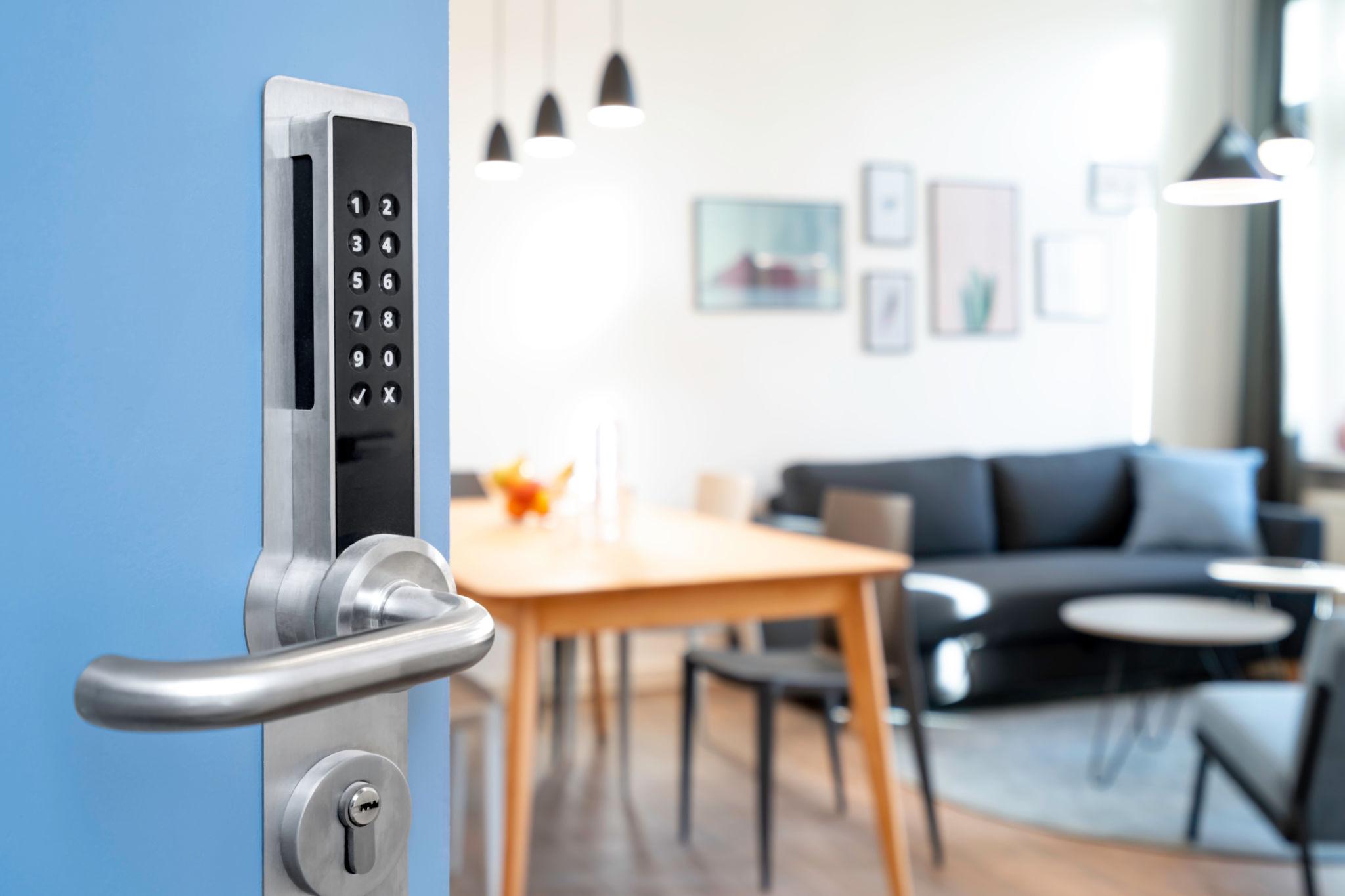 Hotel corridor with a digital smart access lock on a guest room door
